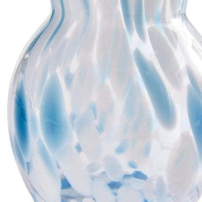 Glass vase with blue and white swirl pattern on a white background