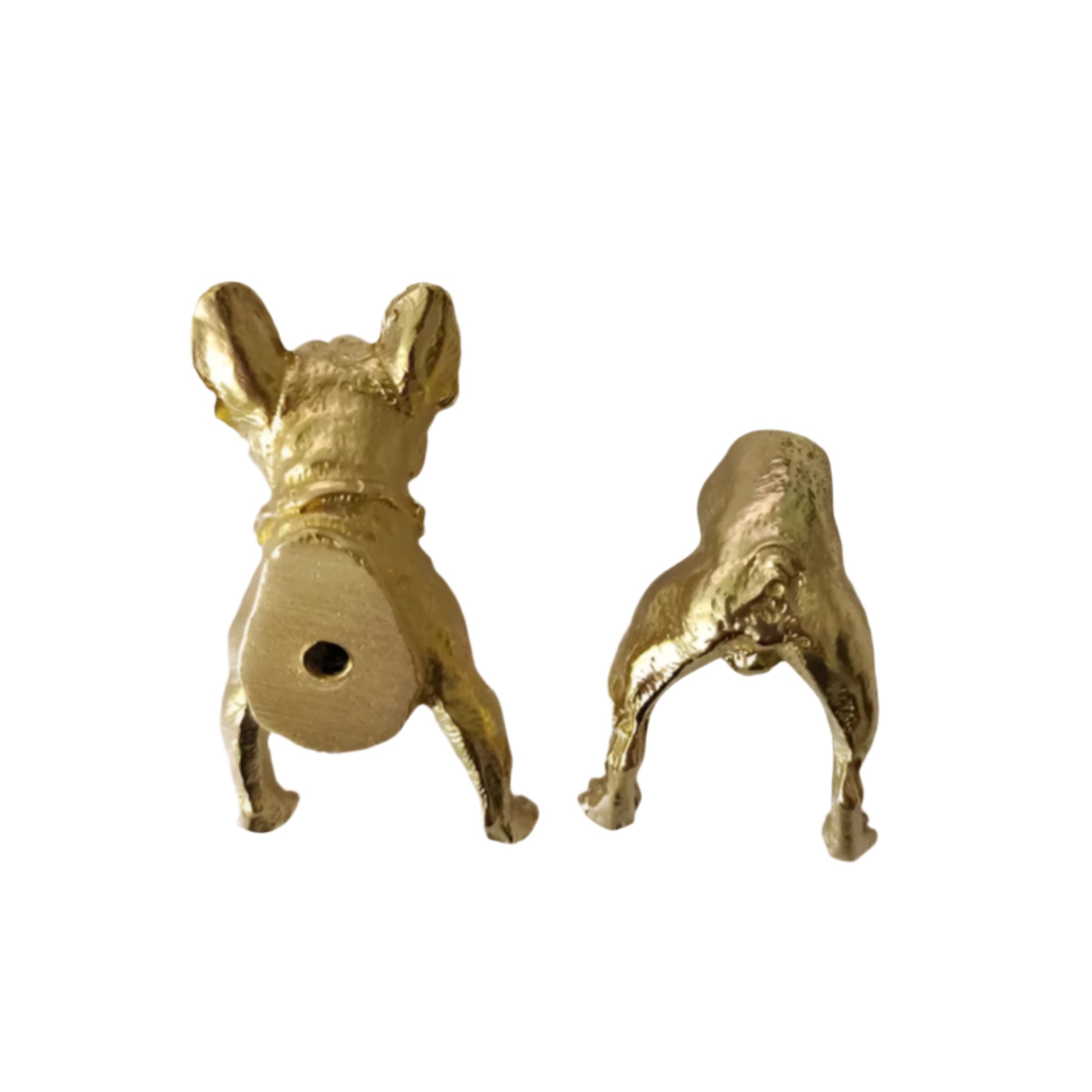 brass dog-shaped handles on neutral backround