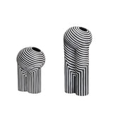Two black and white striped vases  on a white background