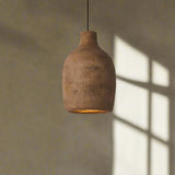 Brown pendant light on a plain background