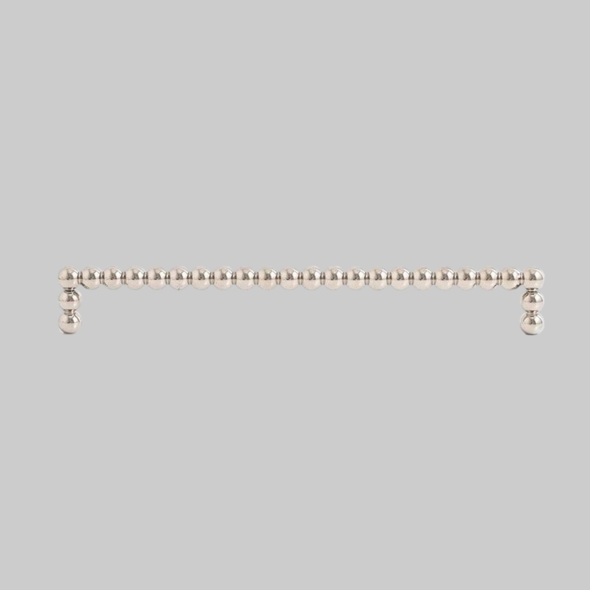 Measurement details of a metallic handle on a white background