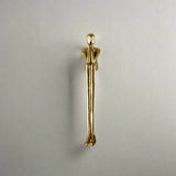Gold-colored door handle on a neutral background