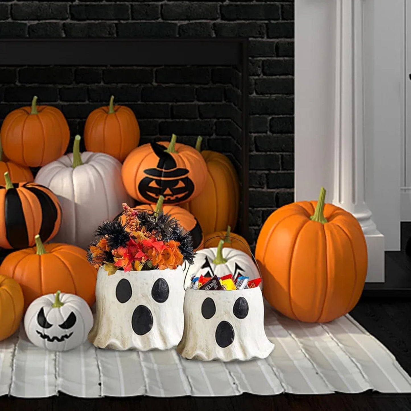 Halloween-themed pumpkins and baskets in front of a black fireplace.