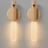 Two wooden wall sconces on a gray background