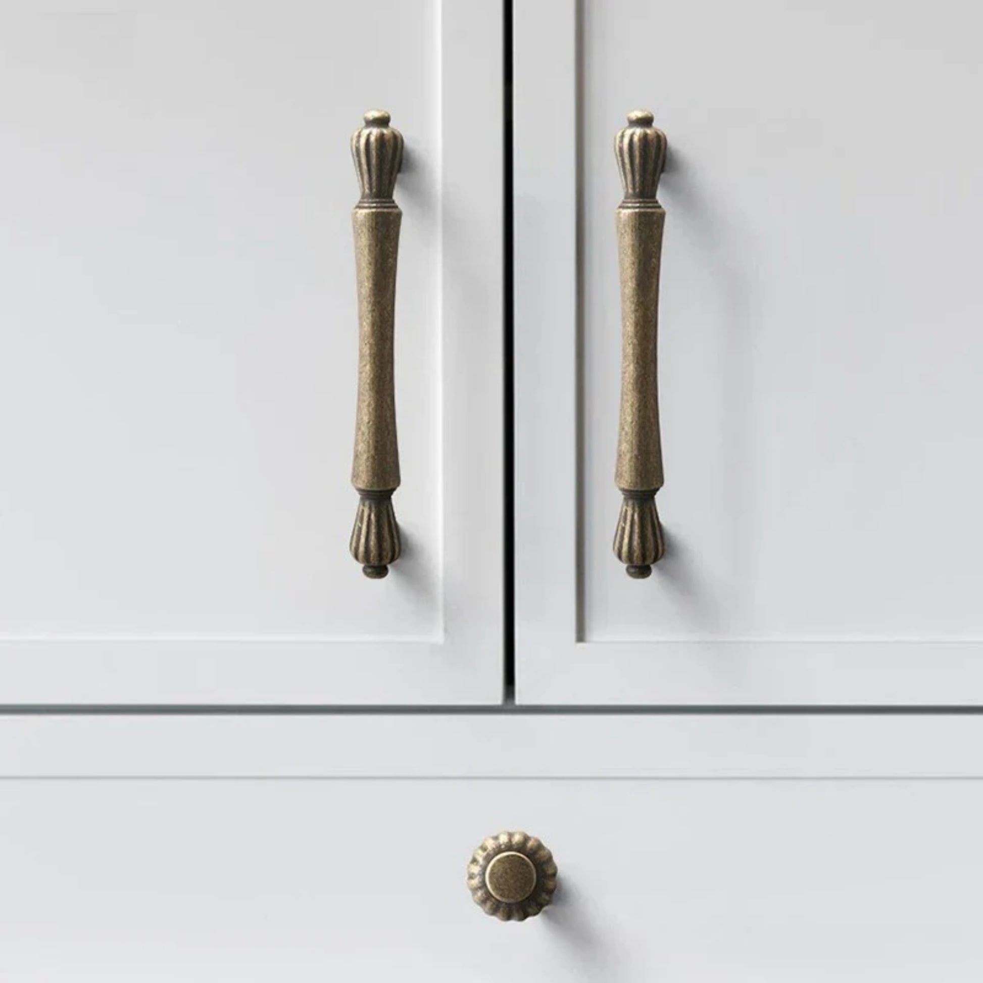 Cabinet doors with brass handles on a white background