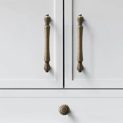 Cabinet doors with brass handles on a white background
