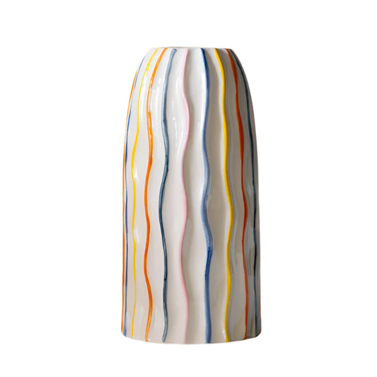 Colorful striped vase on a beige background