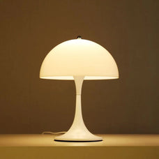 White table lamp on a brown surface with a brown background