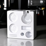 White electronic device with circular components on a reflective surface