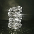 Decorative lamp made of reflective tiles on a dark background
