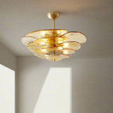 Gold ceiling light fixture on a white wall