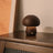 Charming LED Mushroom Night Light – Touch Sensor Wood Bedside Lamp adds a cozy glow to any child's room or decor.