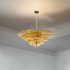 Amber-colored chandelier with dimensions and material details on a white background