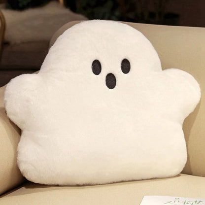 White ghost-shaped cushion on a beige couch