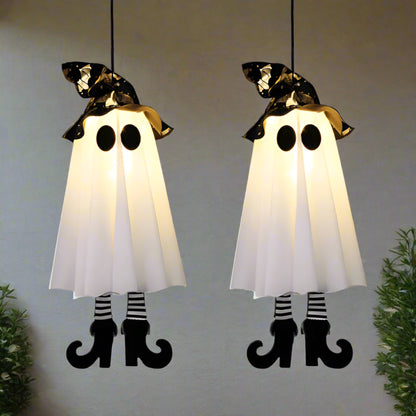 Two Halloween ghost decorations with black hats and striped legs on a white background