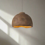 Brown pendant light with measurements on a neutral background