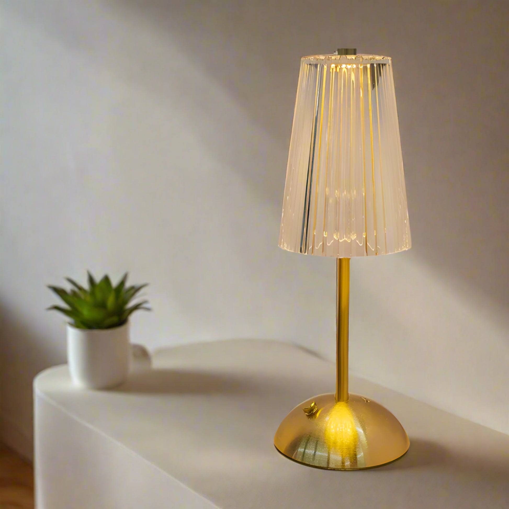 Gold table lamp on side table

