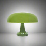 Green table lamp on a neutral surface 

