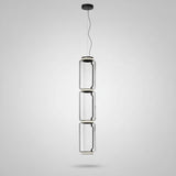 Modern pendant light with cylindrical design on a white background