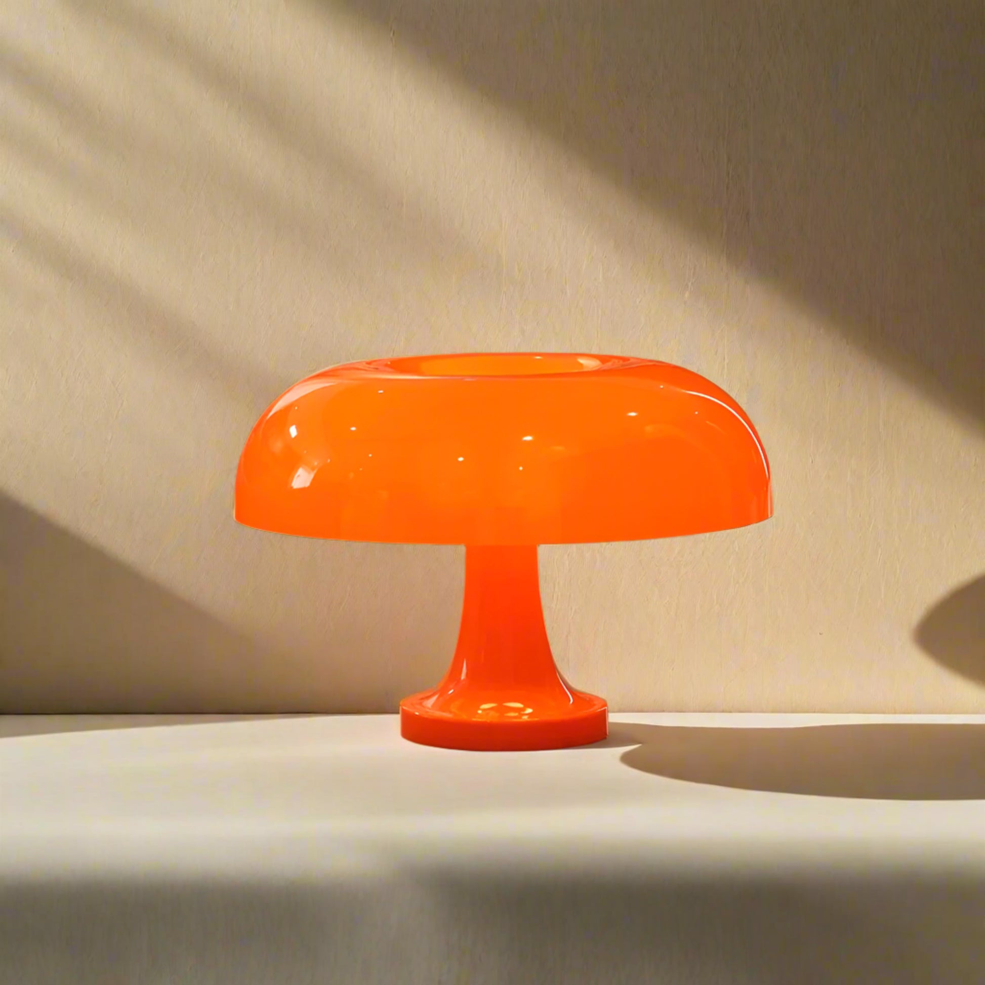 Orange table lamp on a neutral surface 

