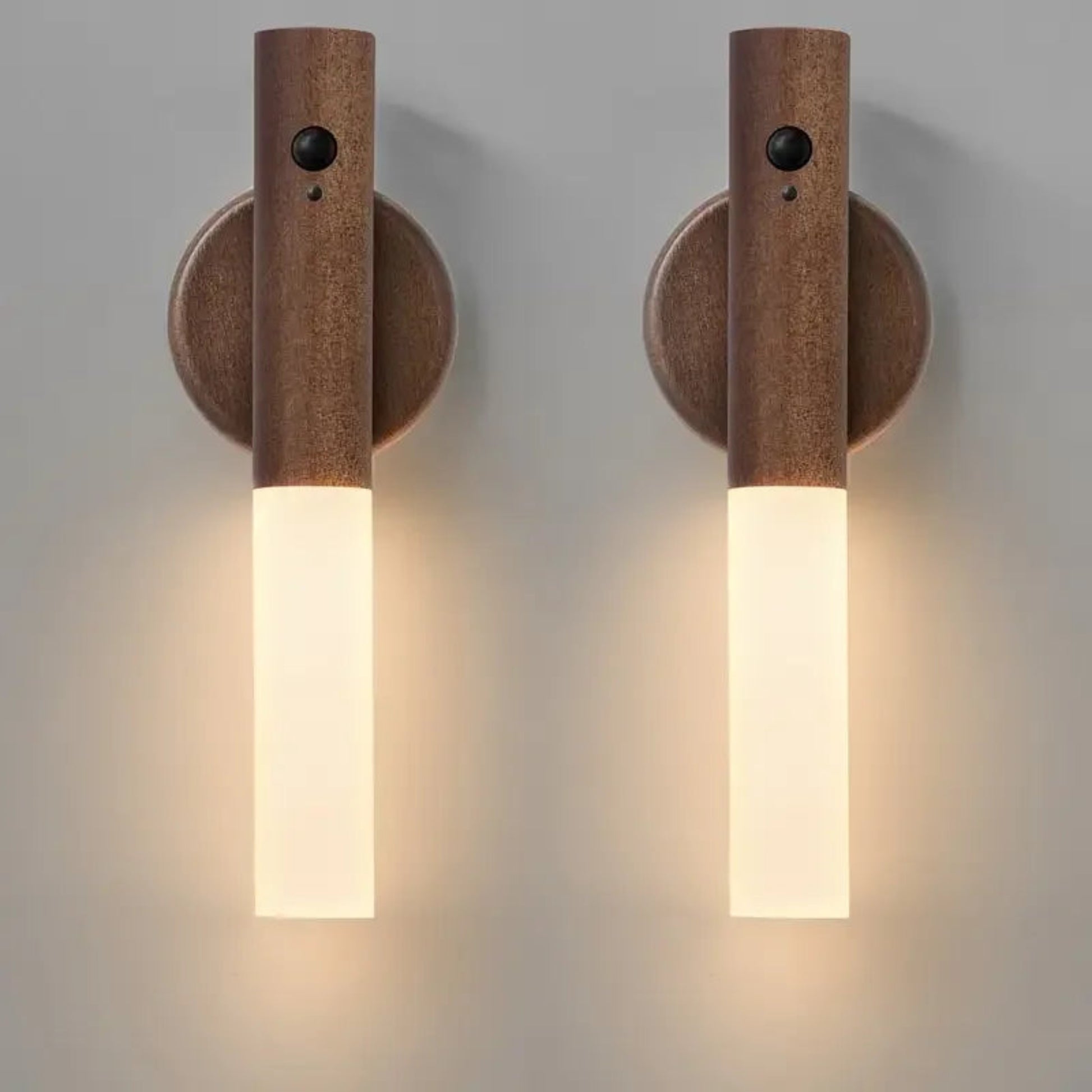 Two wooden wall sconces with cylindrical design on a gray background