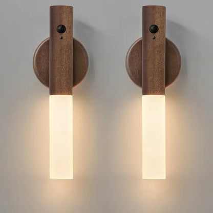 Two wooden wall sconces with cylindrical design on a gray background