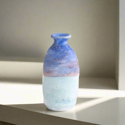Ceramic vase with measurements on a light gray background