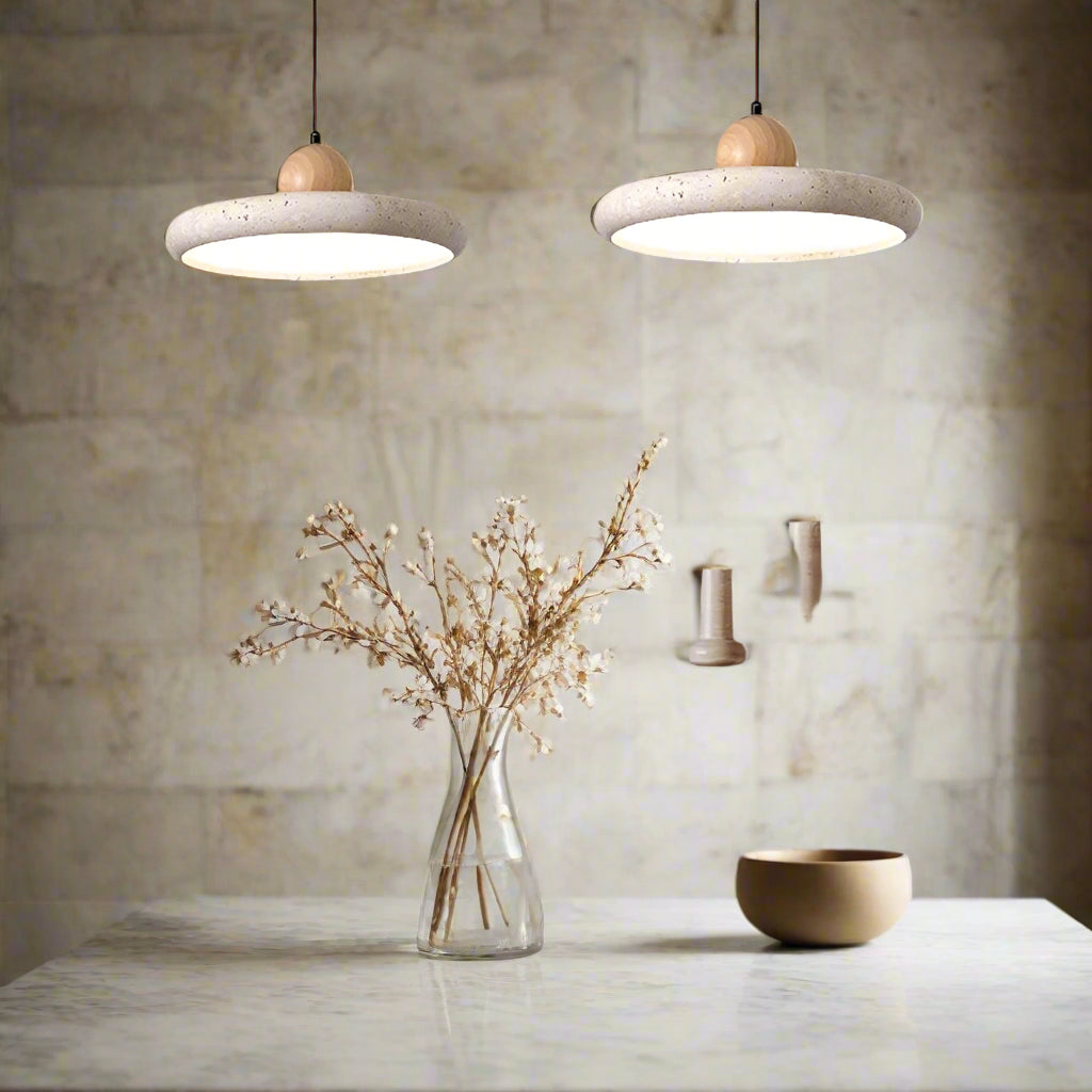 Dining room with pendant lights, table, chairs, and decorative items.