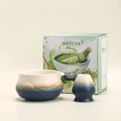 Matcha tea set with two ceramic bowls and a box labeled 'Matcha' on a light beige background.