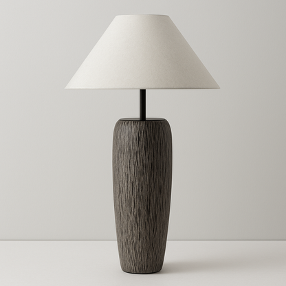 Table lamp with wooden base and white shade on a plain background