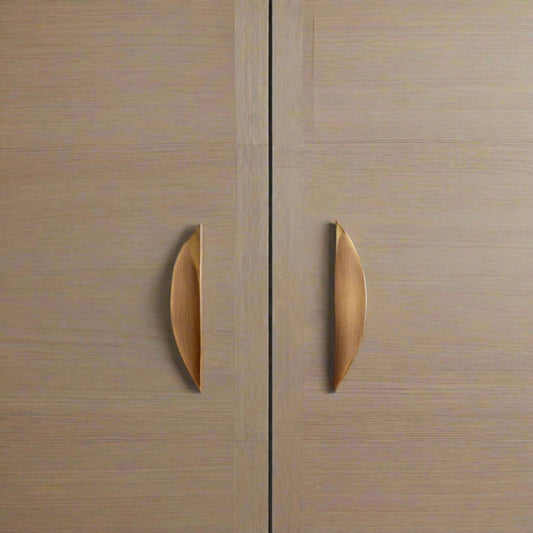 Wooden cabinet doors with metallic handles and 'Santaya' branding.