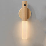 Wooden wall sconce with a light fixture on a gray background