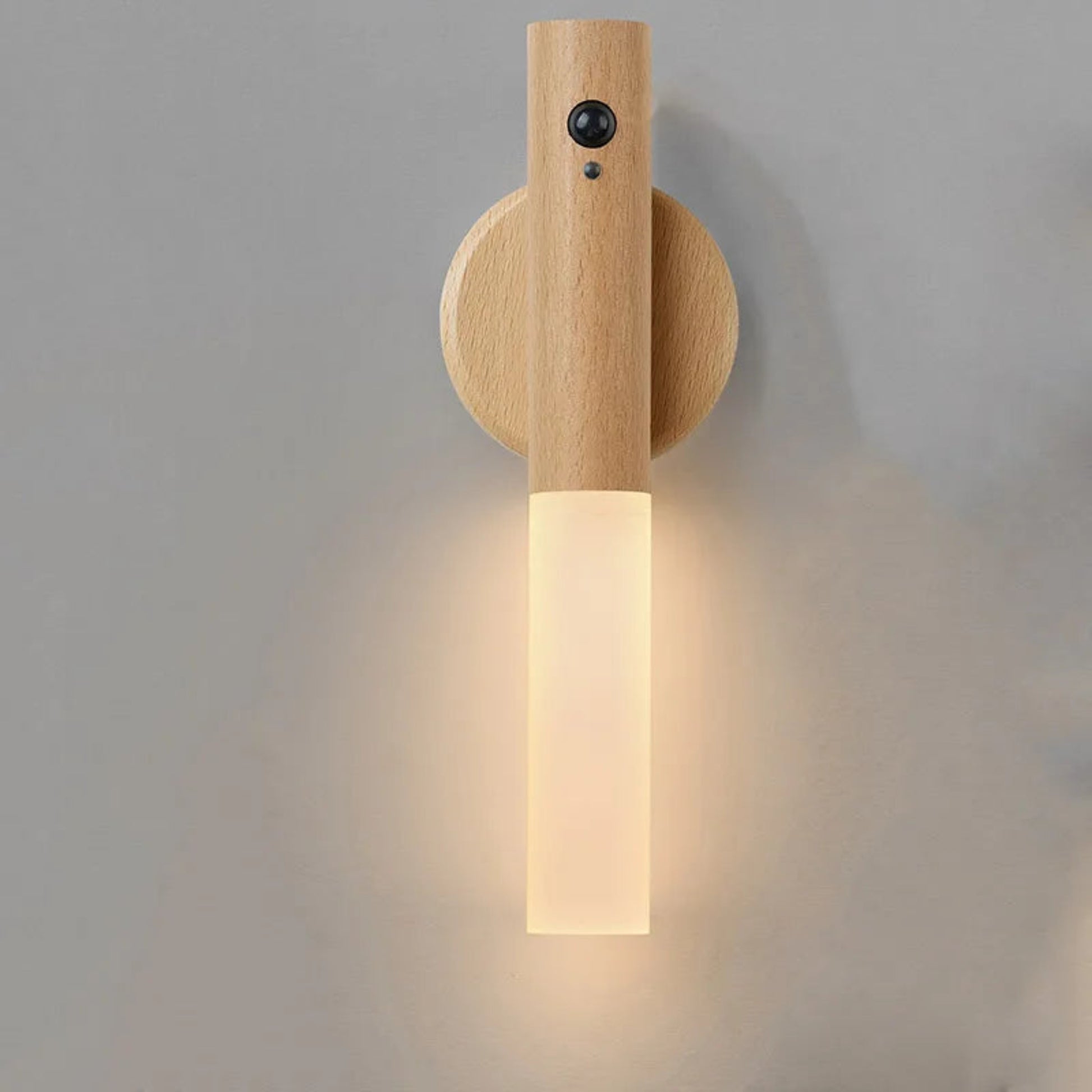 Wooden wall sconce with a light fixture on a gray background