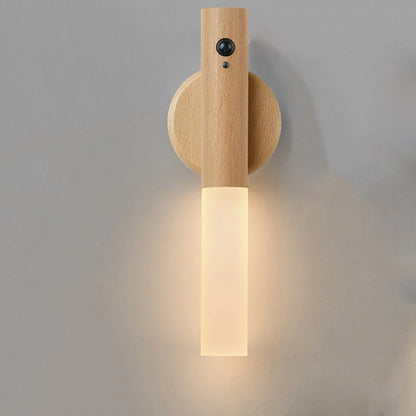 Wooden wall sconce with a light fixture on a gray background