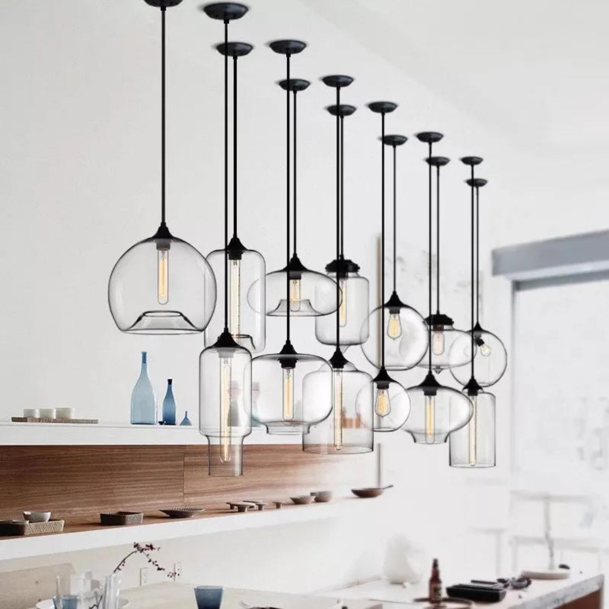 Modern pendant lights with glass shades in a kitchen setting