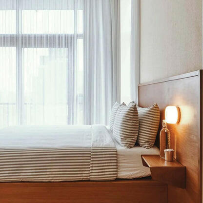 Stylish Modern LED Wall Sconce Amber Smoke Grey bedside lamp enhances any living room, bedroom, or bathroom decor.