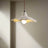 Lotus chandelier with dimensions and material details on a beige background