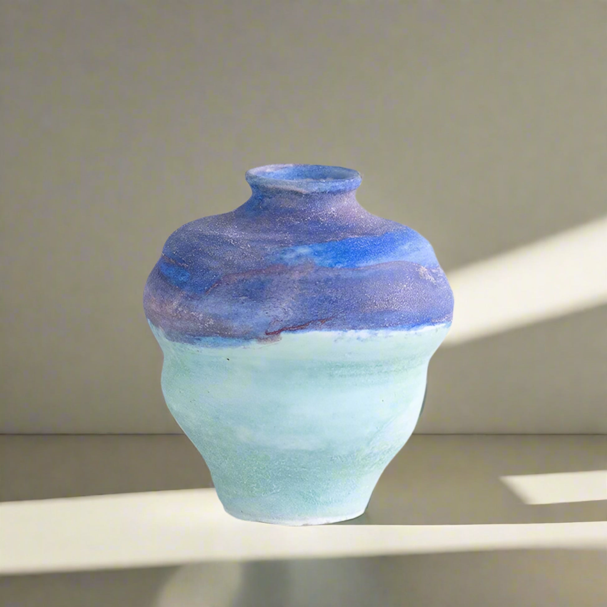 Ceramic vase with blue and green gradient, measurements indicated on a light gray background