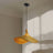 Pendant light with black base and wicker shades on a neutral background.