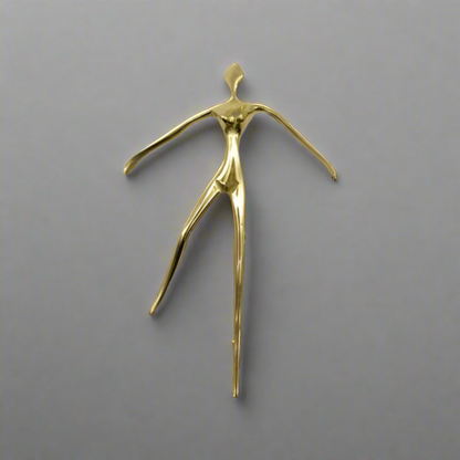 Gold cabinet handle sculpture of a dancer with dimensions on a white background