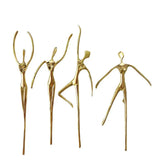 Set of four gold abstract sculptures on a white background