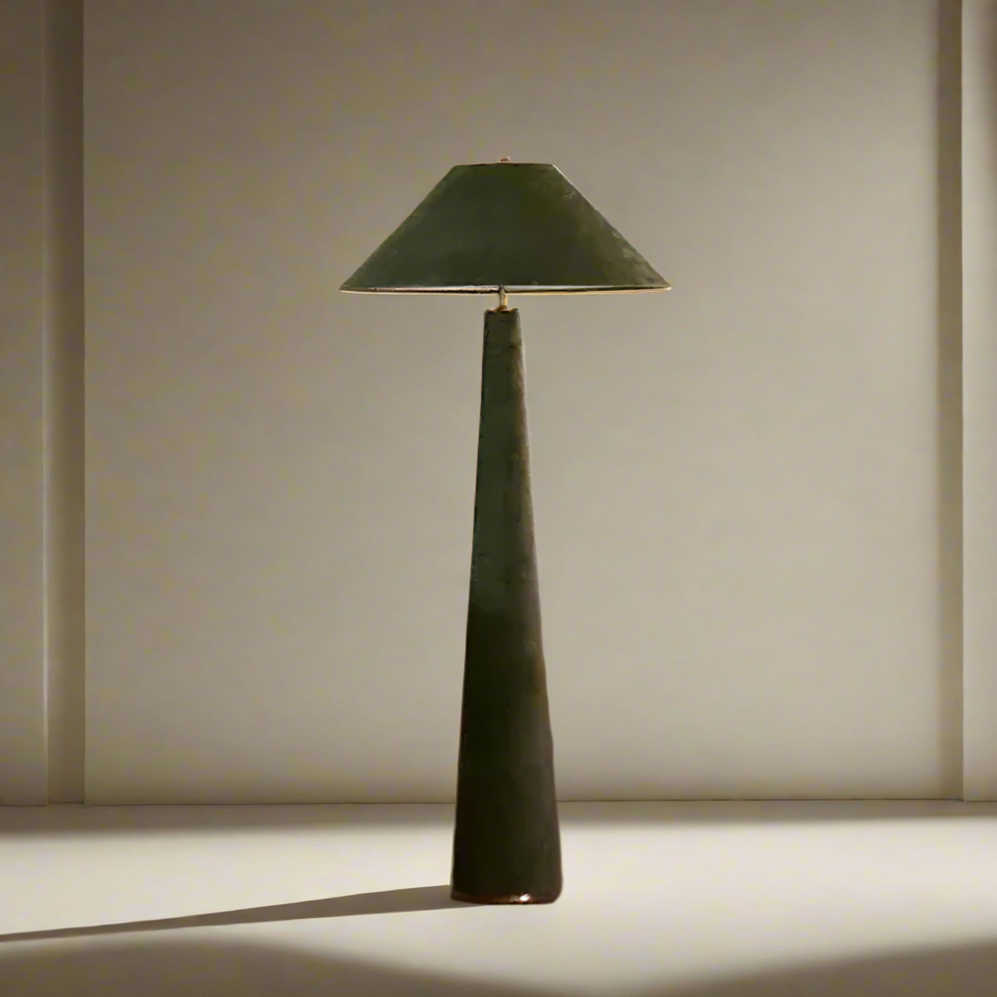 Green floor lamp in a living room setting with a white sofa and wooden chair.

