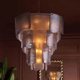 Decorative chandelier hanging in a room with a warm ambiance