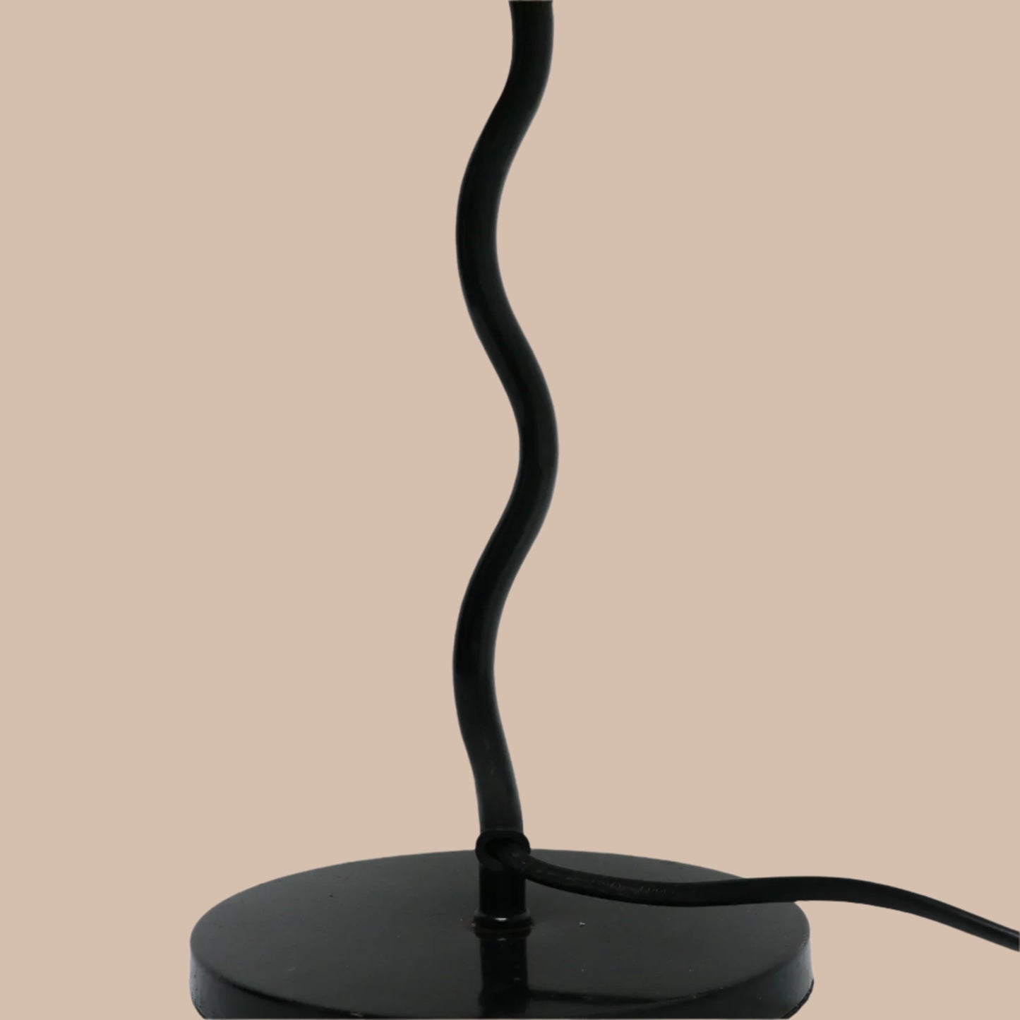 Black desk lamp with a curved design on a white background