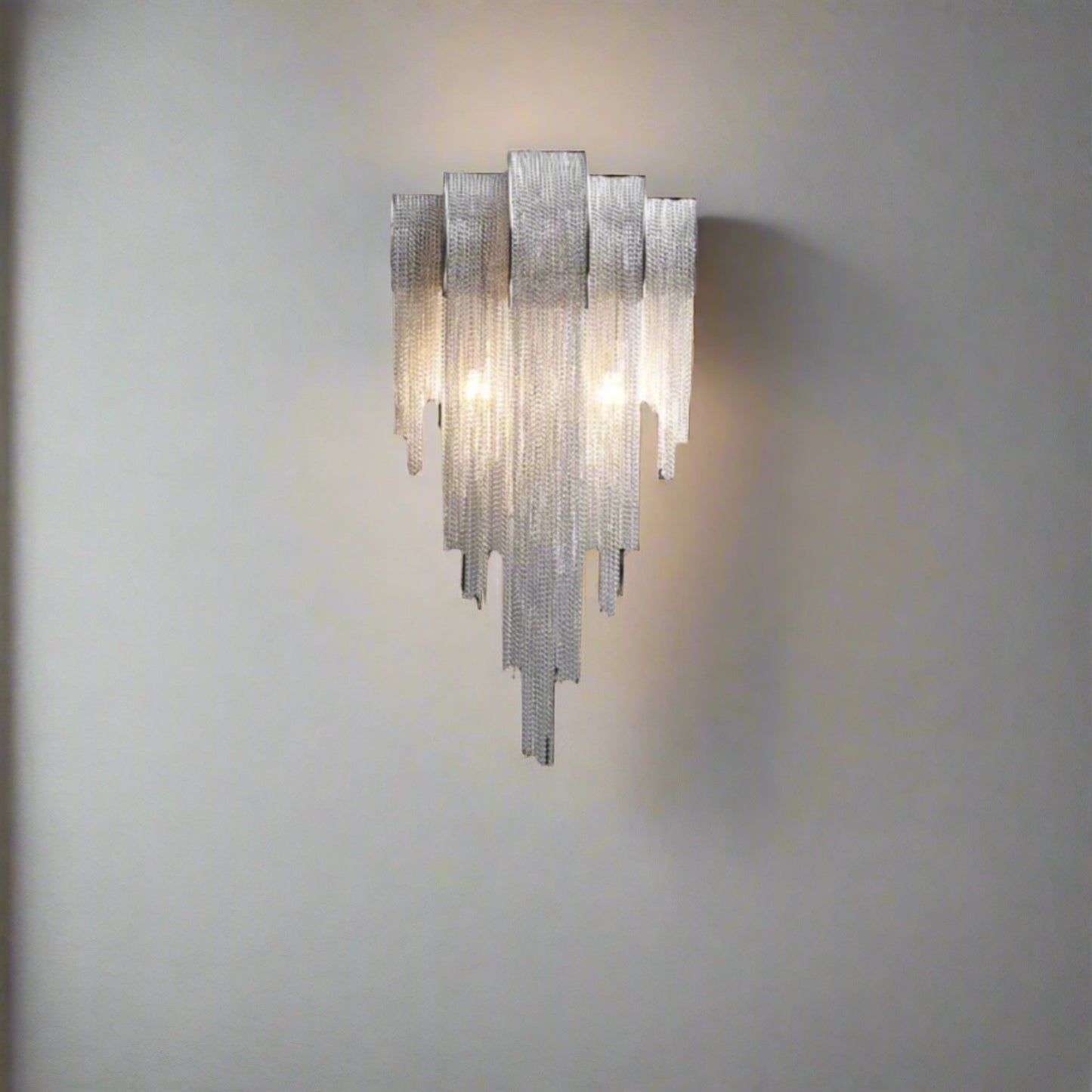 Decorative wall light fixture with dimensions on a black background