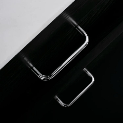 Close-up of a smartphone with a reflective surface on a black and white background