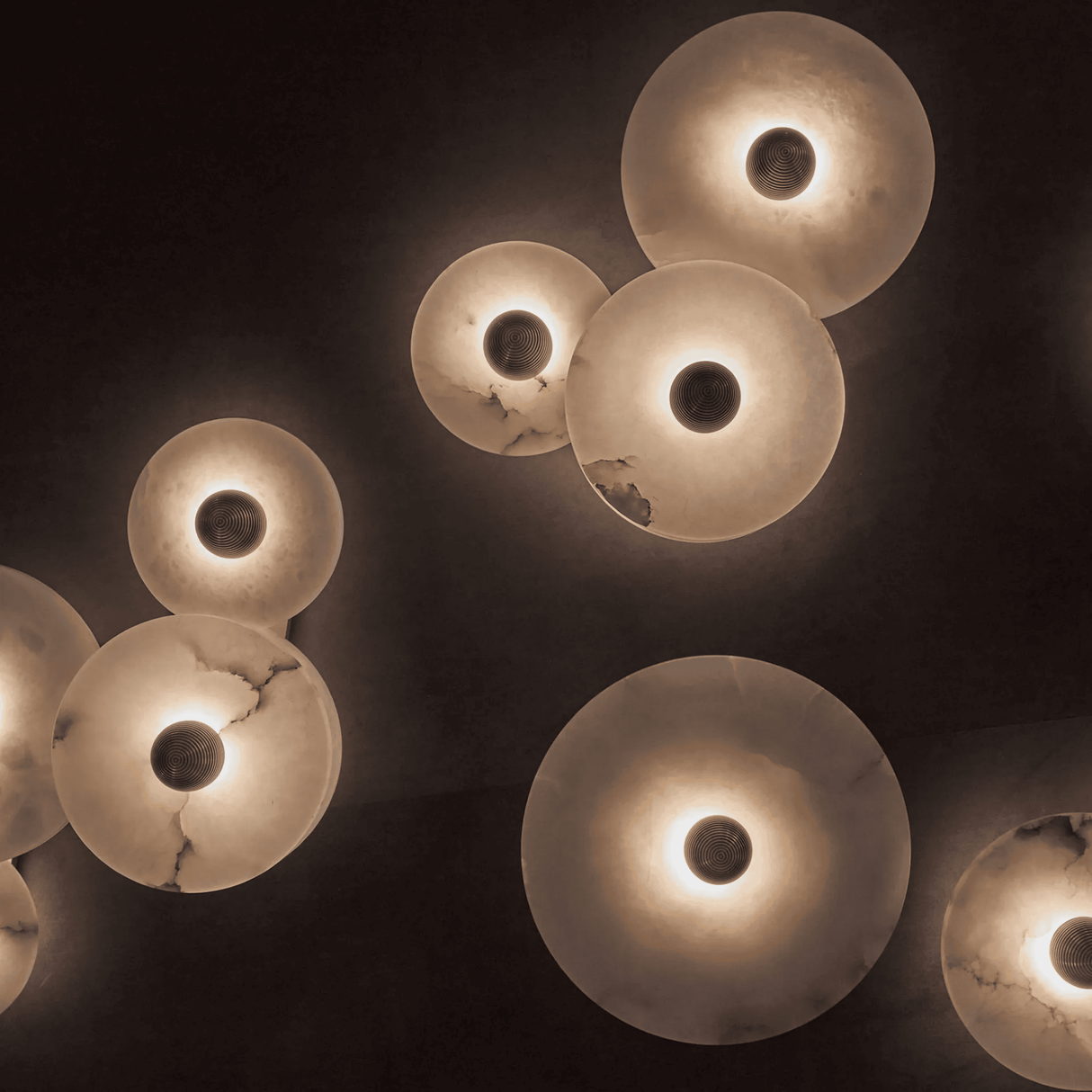 Close-up of multiple light bulbs with a dark background