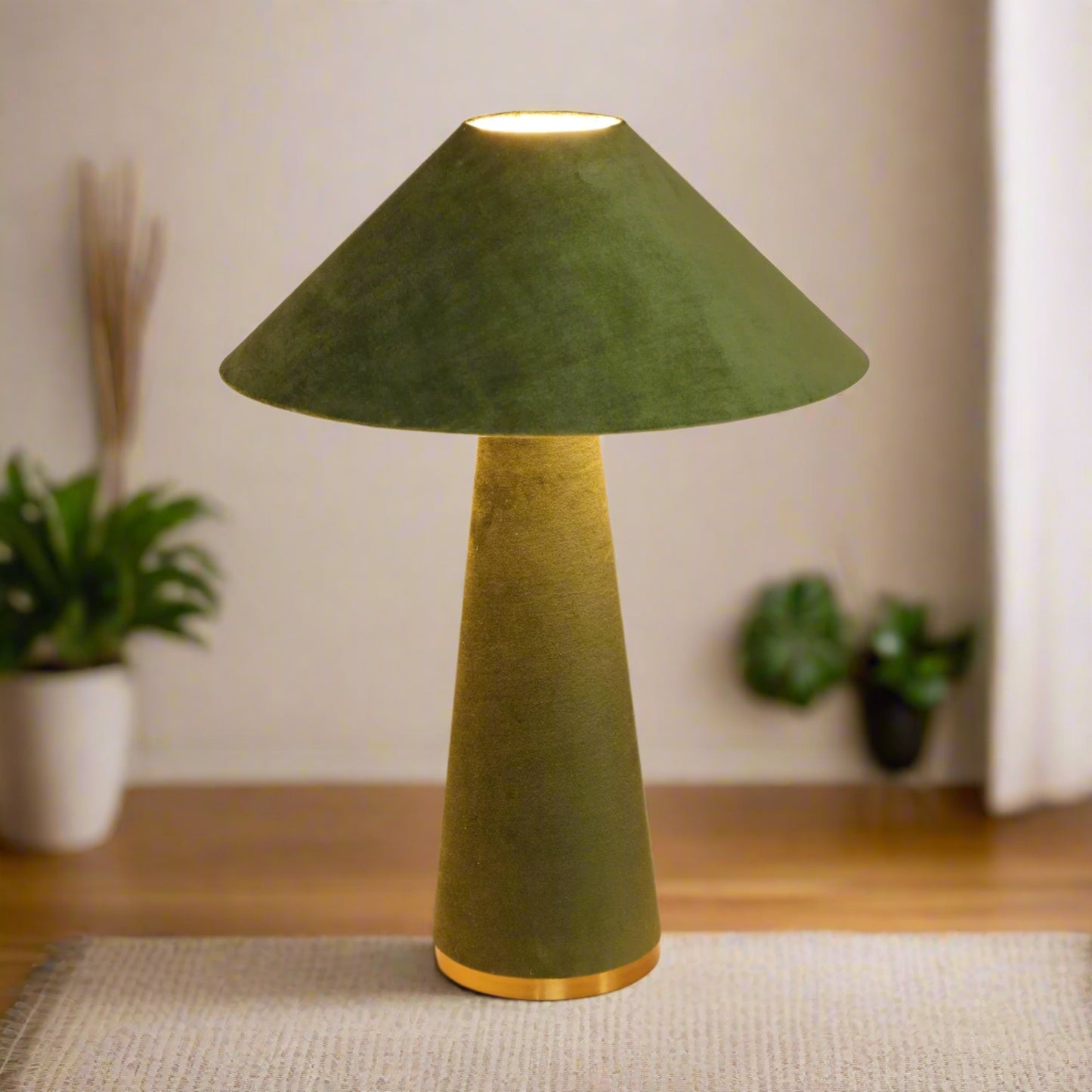 Green table lamp with a cone-shaped shade on a white background

