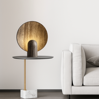 Modern side table with a round wooden top and marble base next to a white sofa.