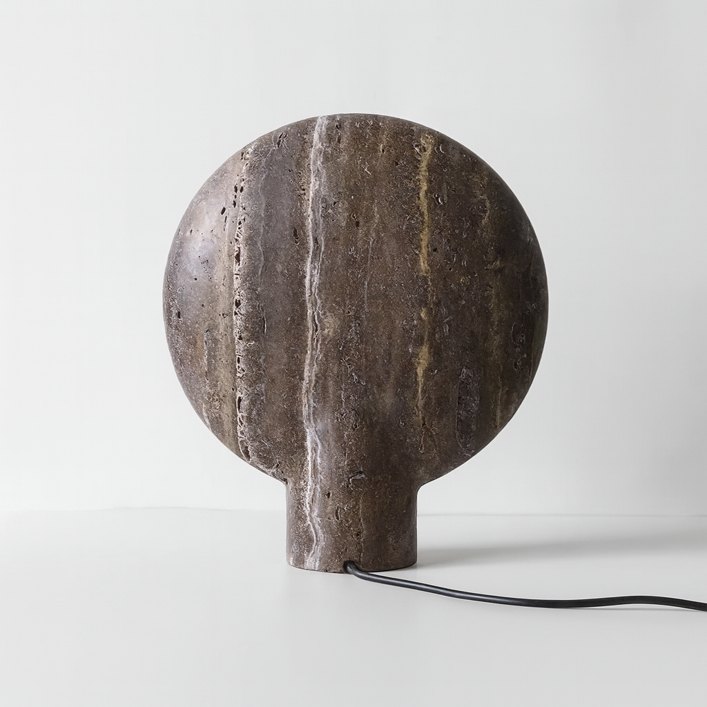Stone lamp with a textured surface on a white background